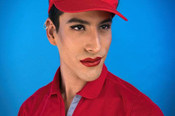 color studio fashion portrait of man with red lipstick by Jason Ward