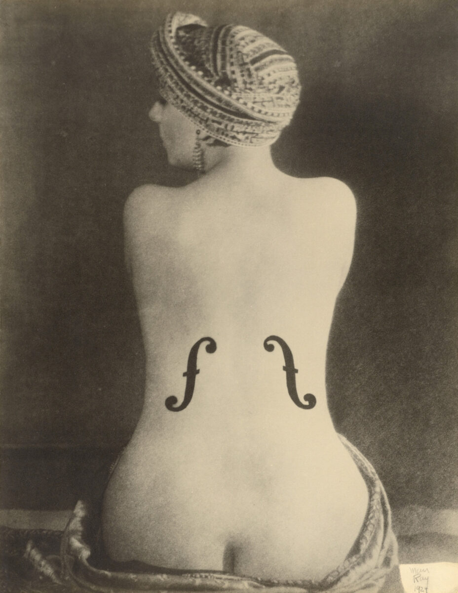 portrait photo of woman in shape of violin by Man Ray