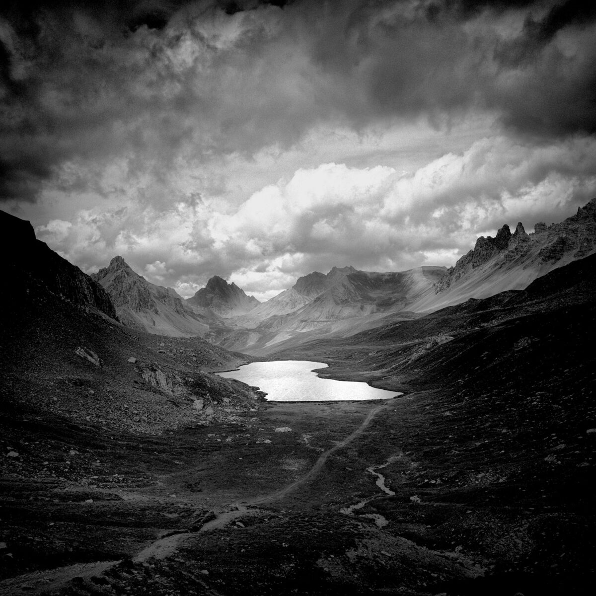 black and white landscape photo of mountain and lake, Mercantour NP, France/Italy by Aurelio Bormioli