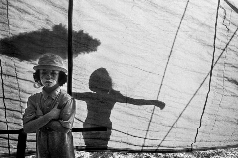 black and white documentary photography by Flavio Cannalonga, Brazil, boy dressed as clown