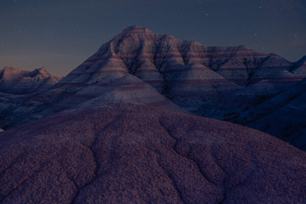 night color landscape photo of sky and dunes in Badlands in South Dakota by Erin Cahill