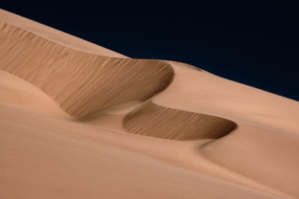 color landscape photo of a sand dune in Walvis Bay desert in Namibia by Rémi Bergougnoux