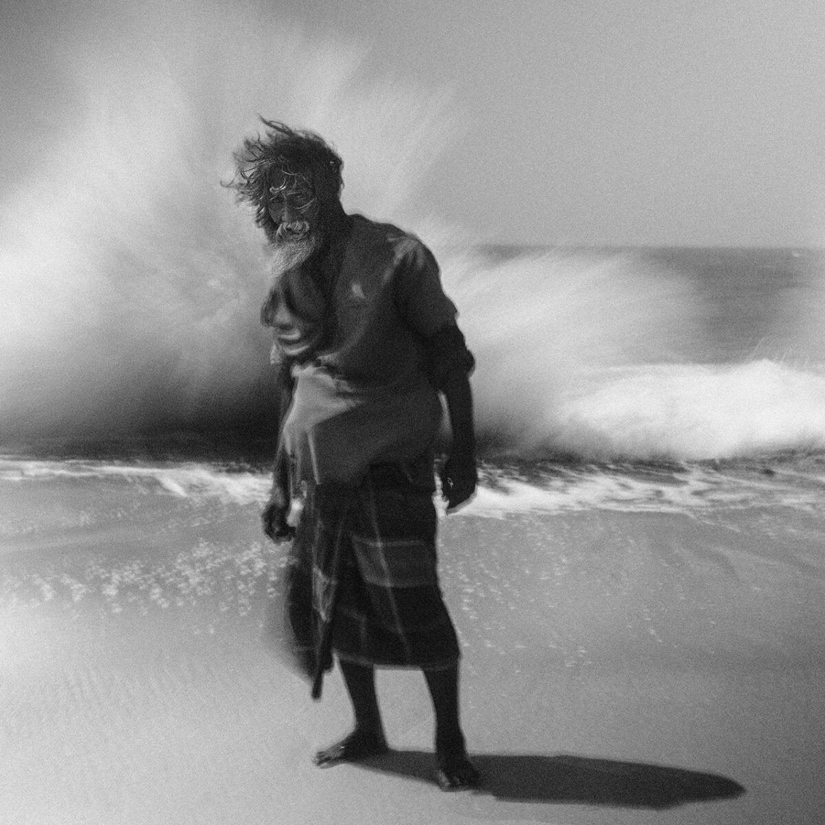 black and white portrait of a man on the beach in Northern Sri Lanka by Adam Docker