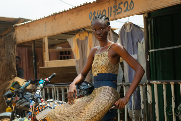 color fashion portrait of a female model on motorcycle in Ghana by Fiifi Abban