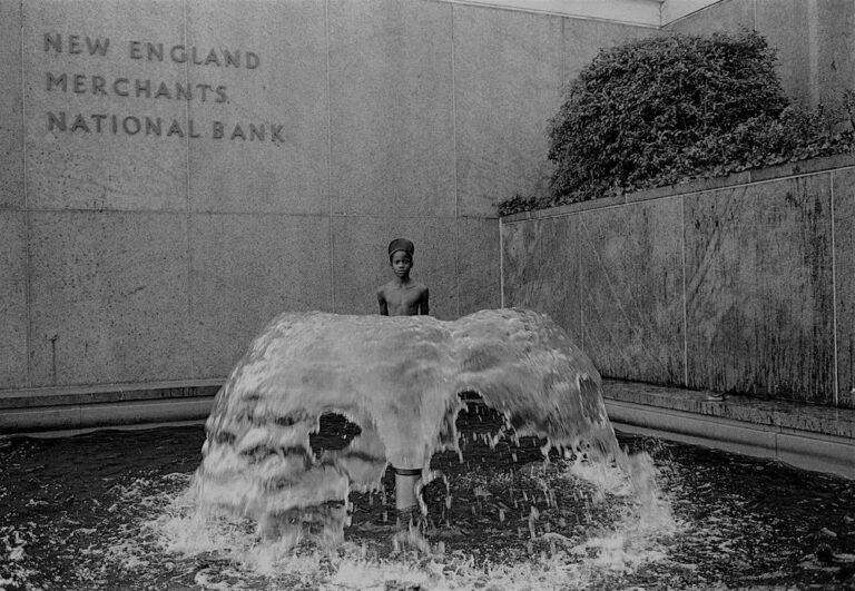 Black & white street photography by Richard Sandler, boy in fountain