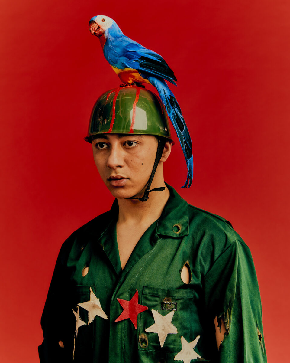 color fashion studio portrait of a male model wearing military clothes by Victoria Ruiz