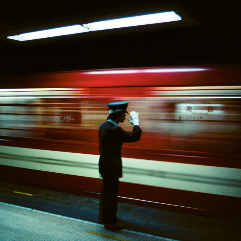 Photography by greg Girard, platform conductor, Tokyo metro. 1976