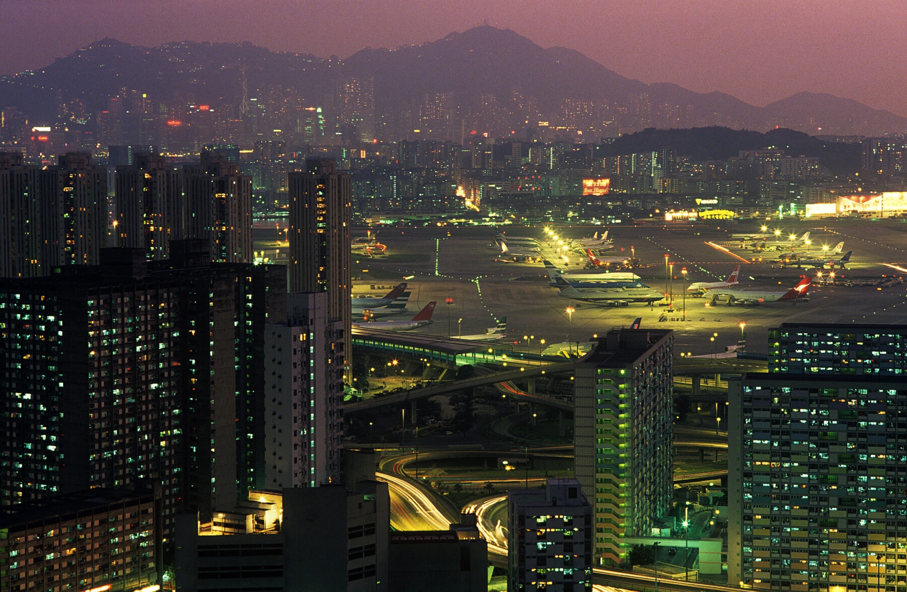 Photography by greg Girard, Hong Kong airport, 1989. Sunset