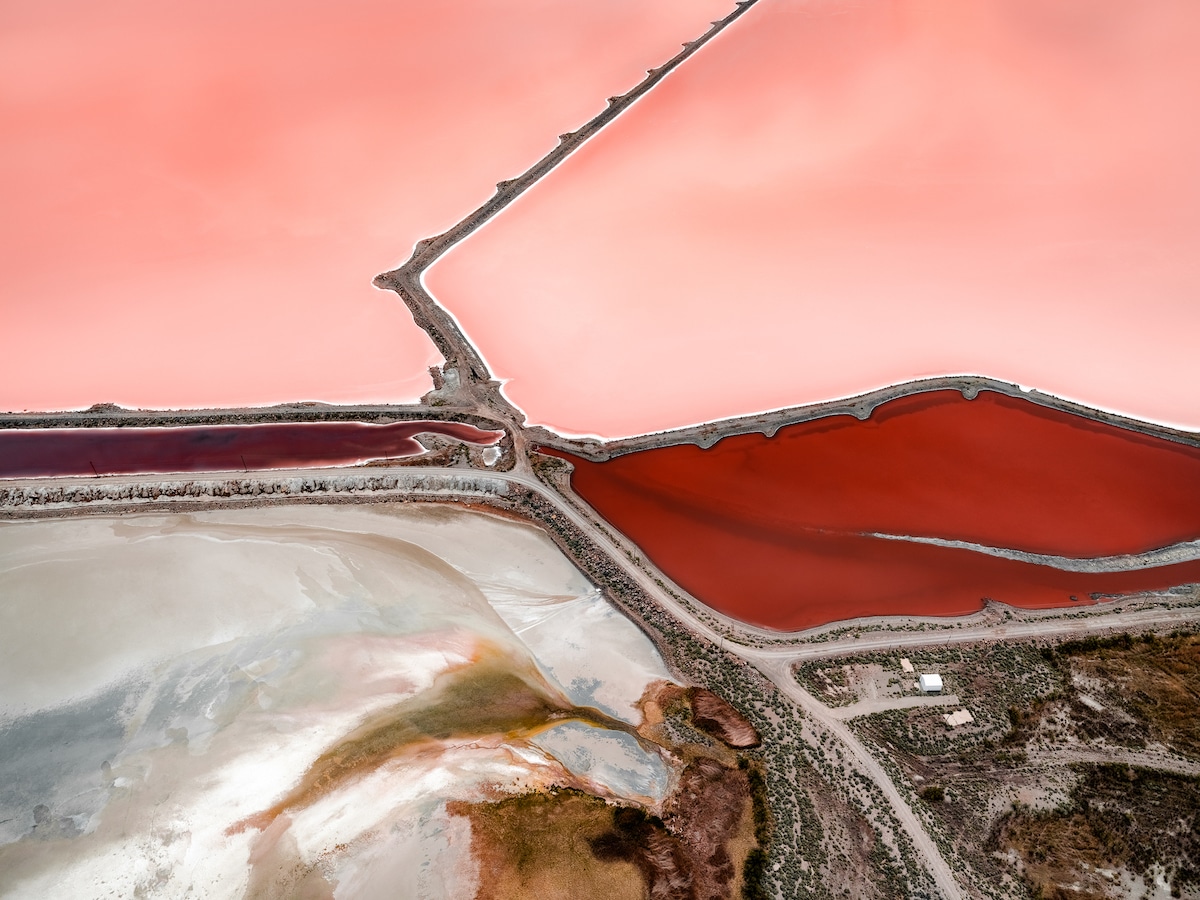 Aerial landscape photography by Tom Hegen of pink and red salt pools. From the book Salt Works.