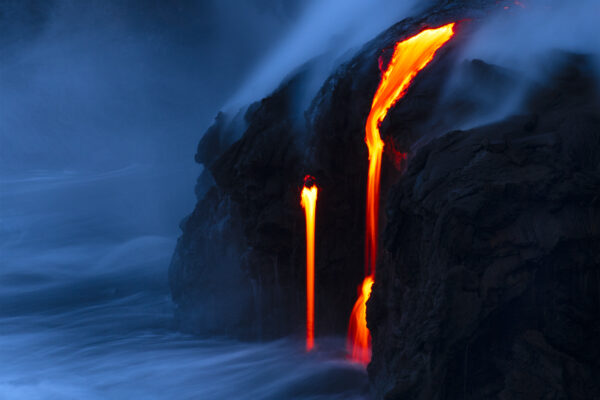 color night landscape photo of lava flowing in the ocean in Hawaii by Stephen King