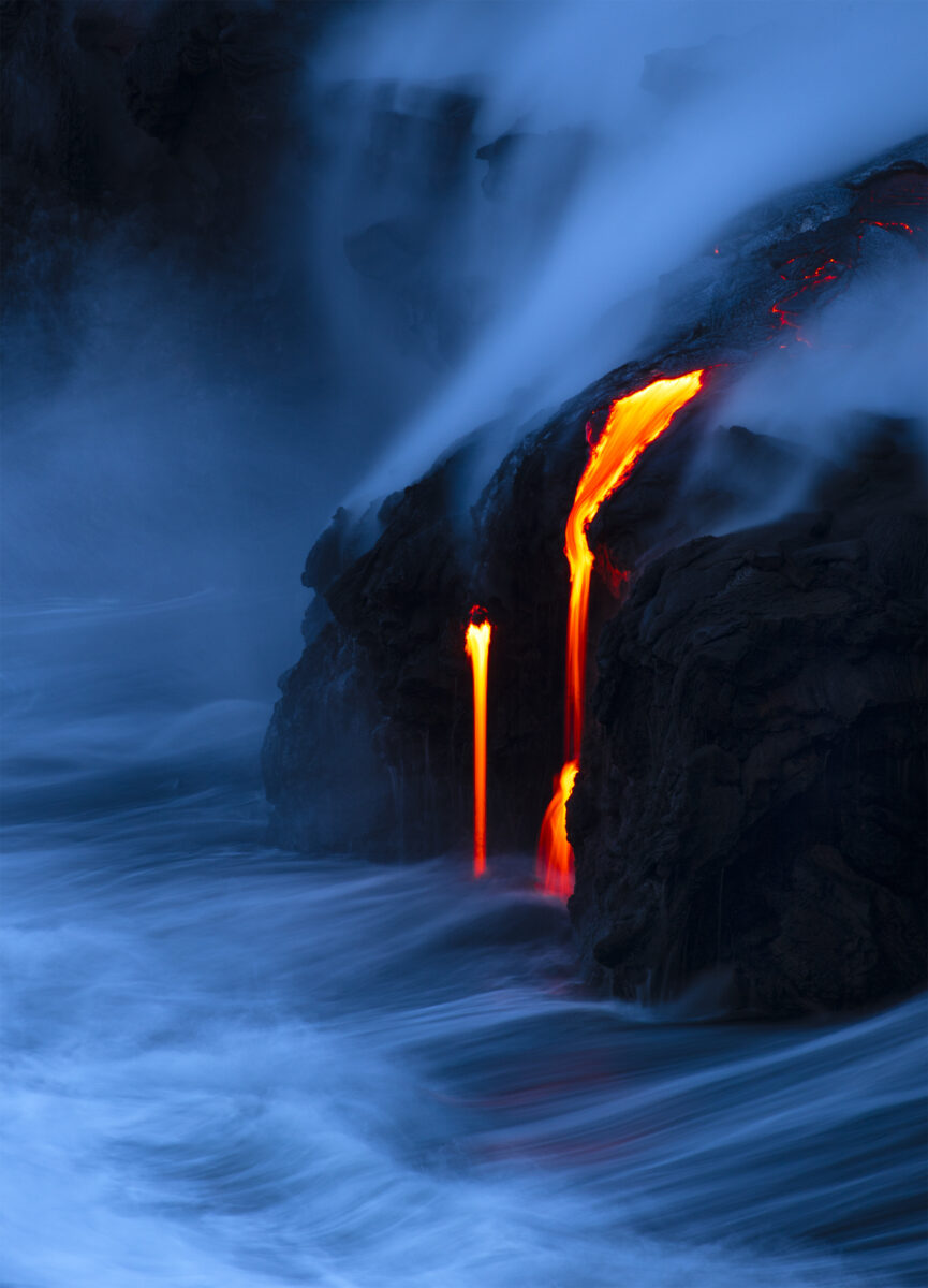 color night landscape photo of lava flowing in the ocean in Hawaii by Stephen King