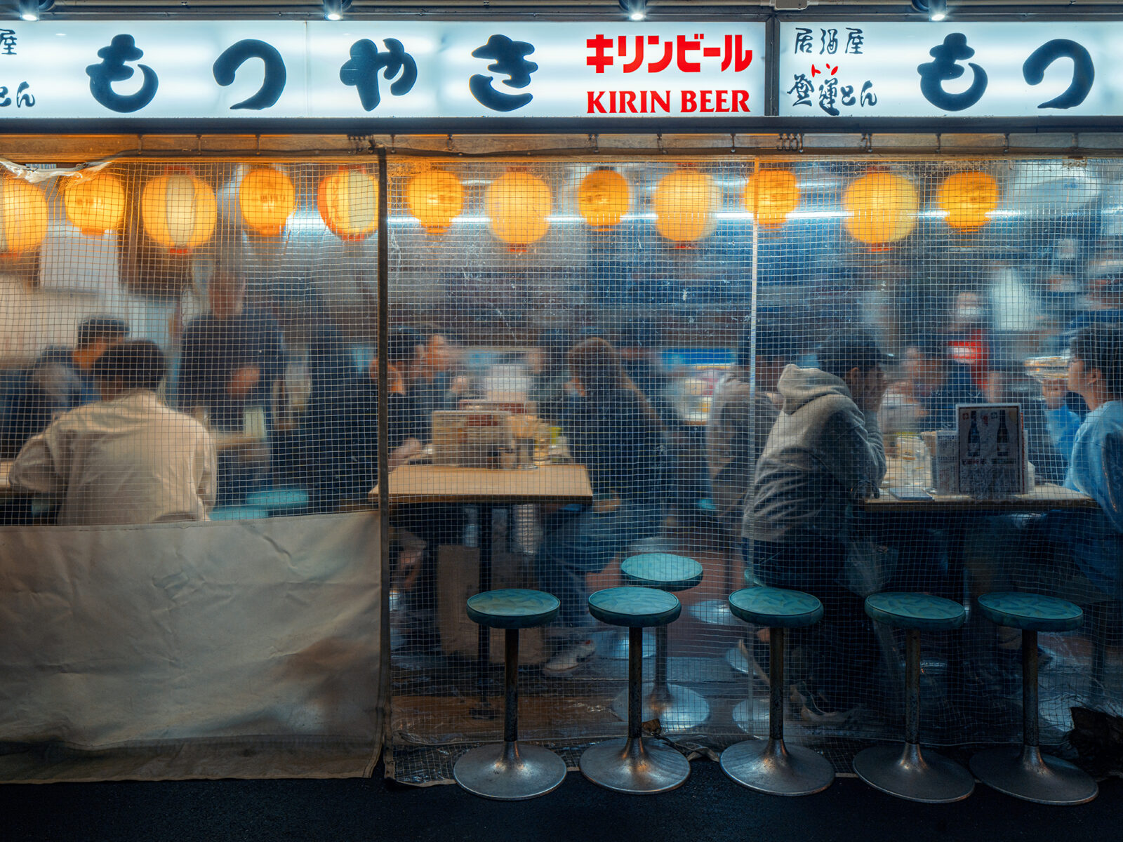 Color photo of an Izakaya under the railway embankment around Yurakucho station, Tokyo by Alessandro Zanoni