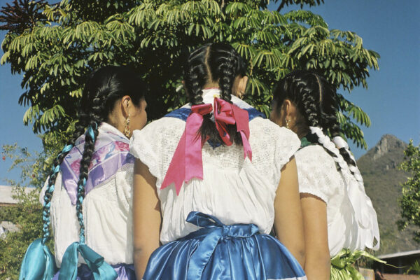 Portrait of Three girls wearing the traditional festive dresses at Teotitlan del Valle in Oaxaca, Mexico, by Irene Baque