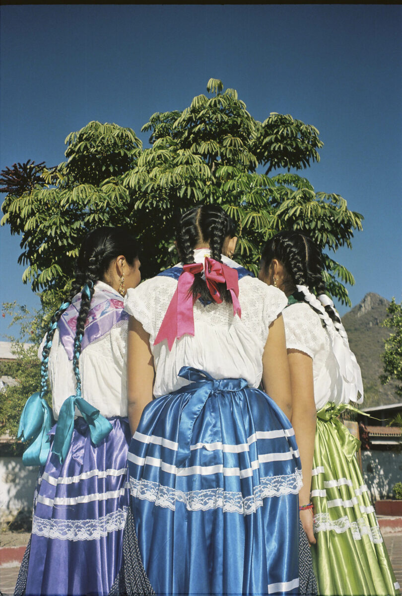 Portrait of Three girls wearing the traditional festive dresses at Teotitlan del Valle in Oaxaca, Mexico, by Irene Baque