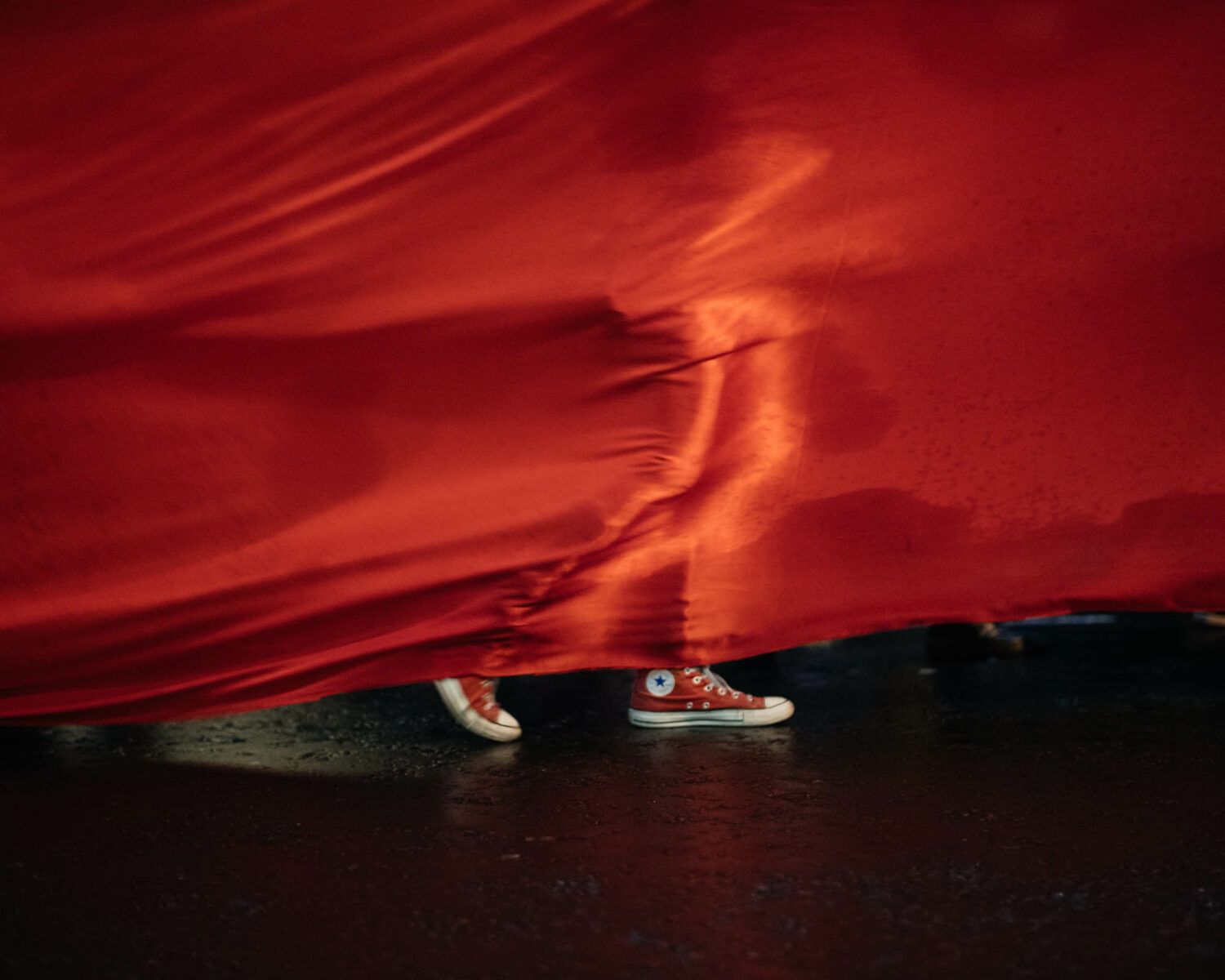 Color photography by Joshua K. Jackson, red flag and red shoes.