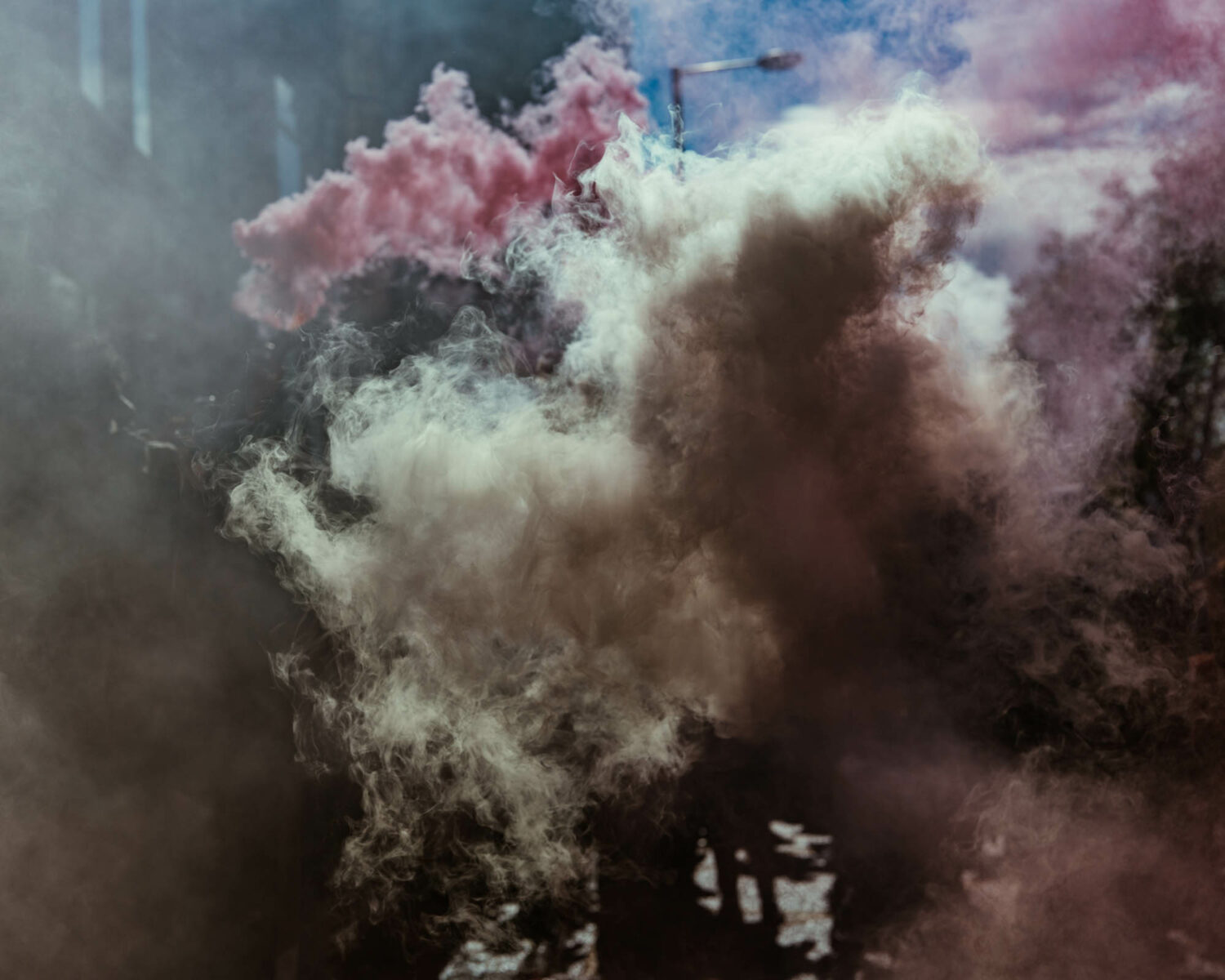 abstract color photo of colorful smoke in street by Joshua K. Jackson