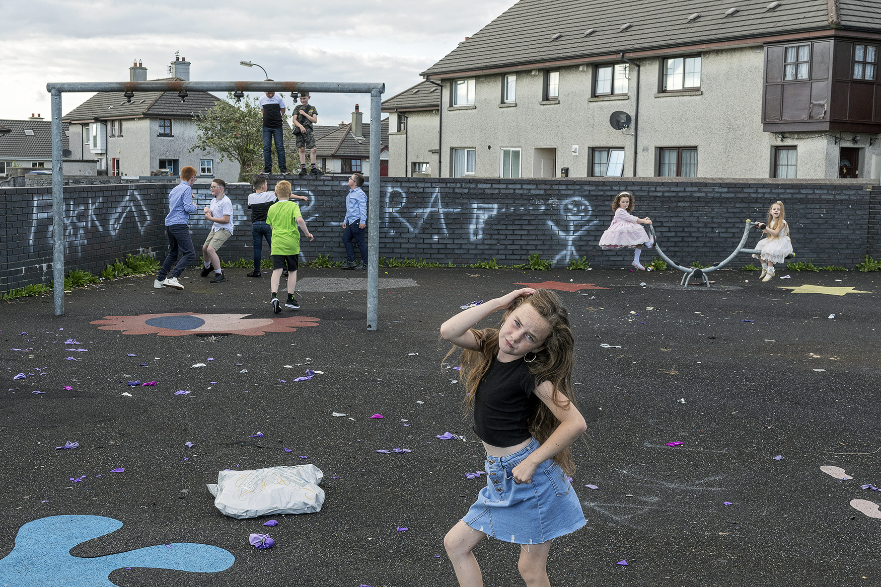 color street photo of children at playground in Galway, Ireland by Joseph-Philippe Bevillard