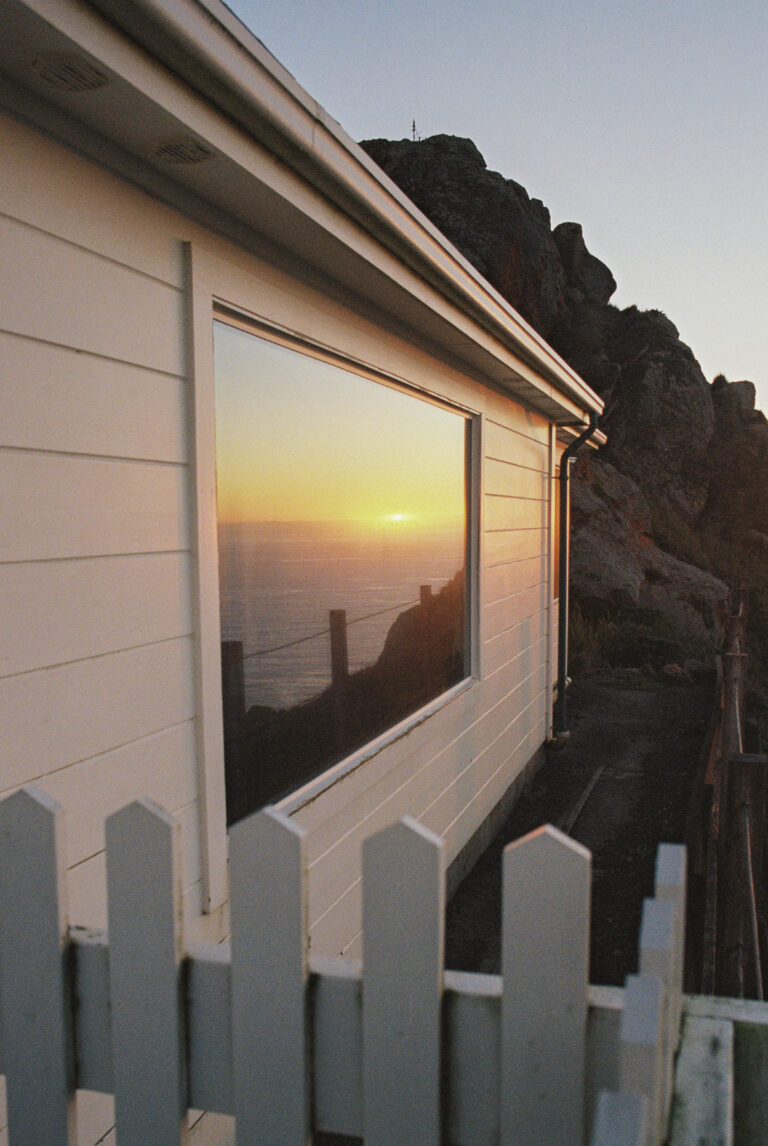 Color film landscape photography by Jakob Lilja-Ruiz. Sunset reflections in a window