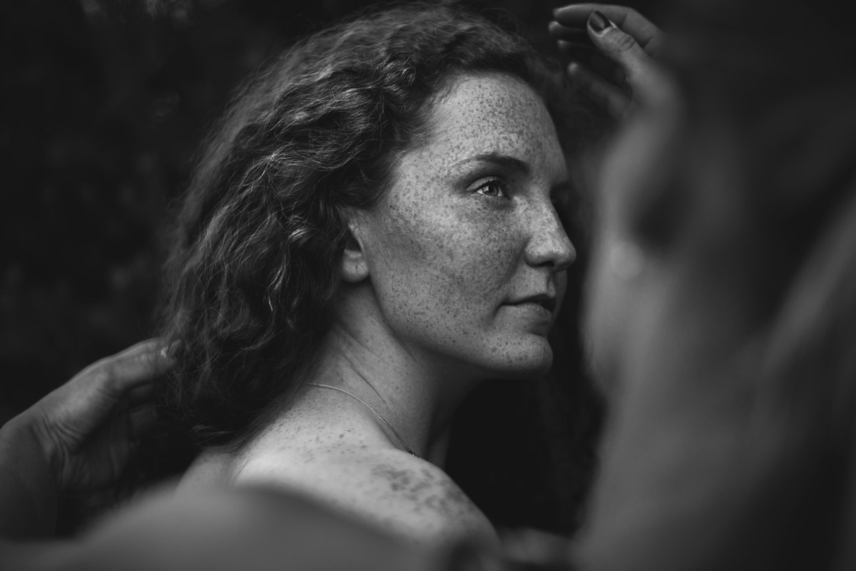 black and white portrait photo of a woman with freckles by Rafal Lapszanski