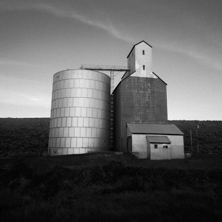 Black & white landscape photography by Adrian Vila. Old mill style building