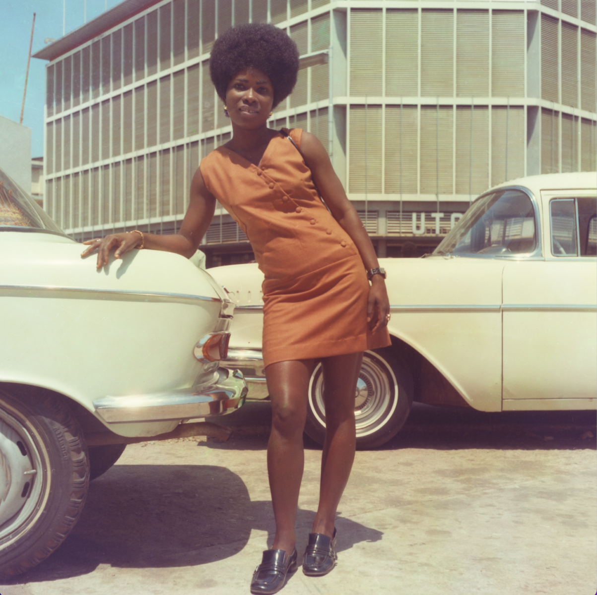 Portrait photography of young woman in Accra, Ghana by James Barnor