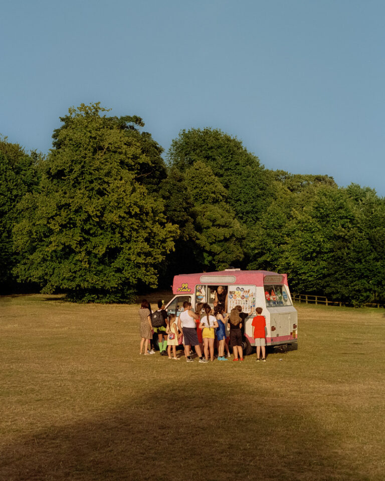 Color photography by Ian Howorth. Ice cream van and children in a field