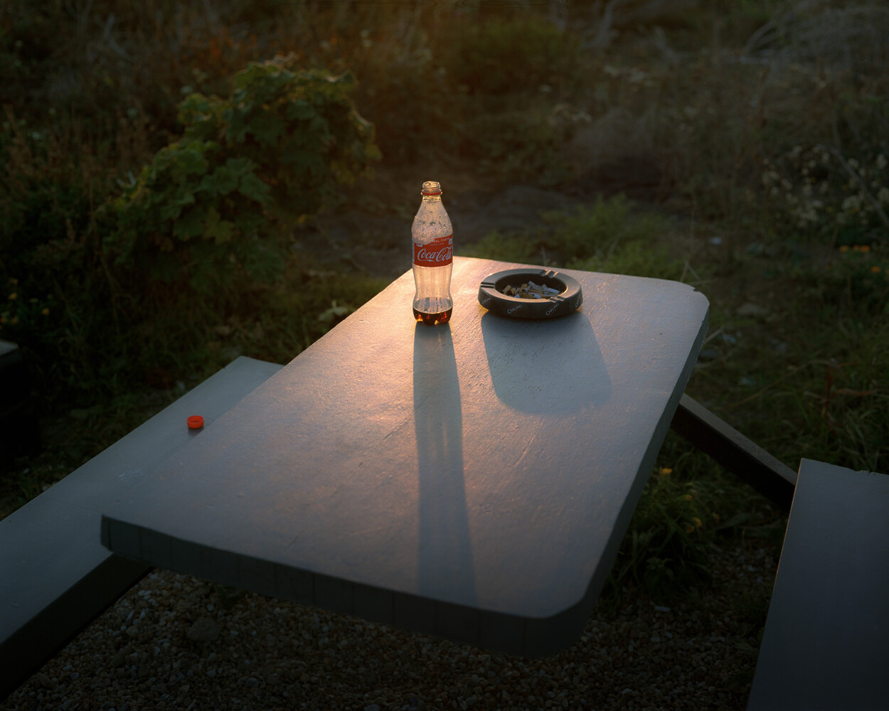 Photo of coke bottle on table by Ian Howorth, from A Country Kind of Silence