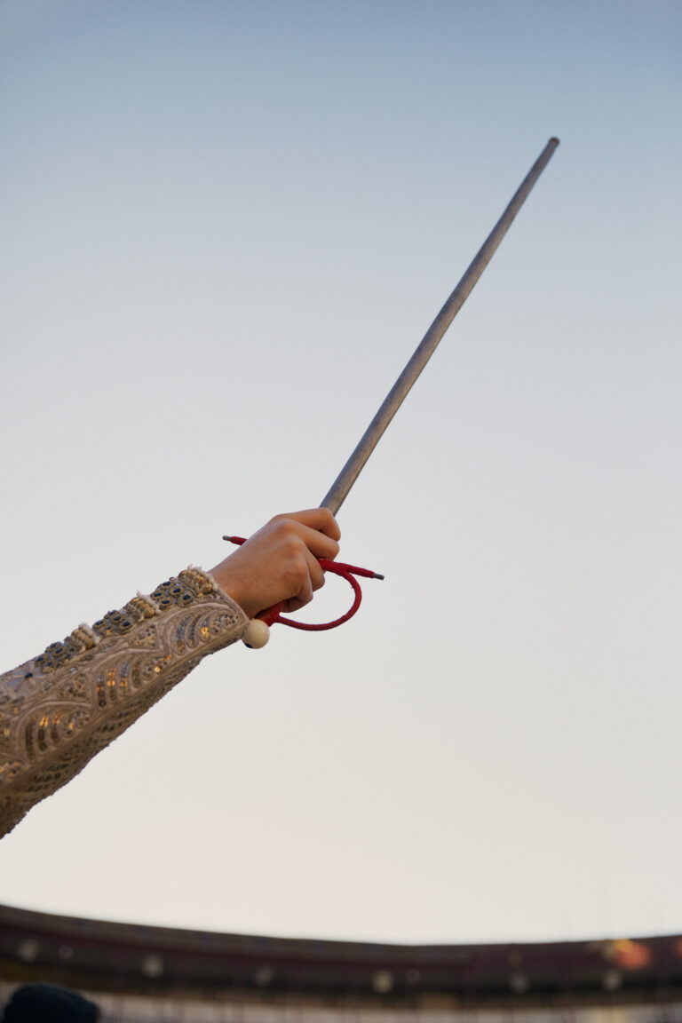 Photo of a bullfighter's hand holding a sword