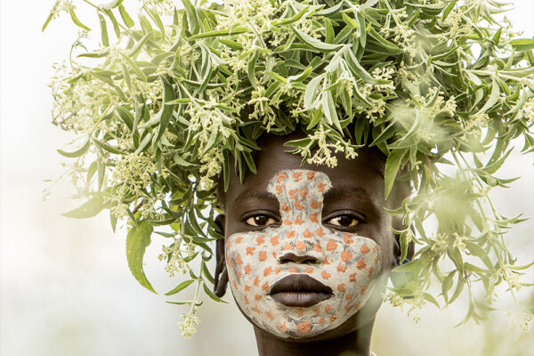 color portrait of a young girl from suri tribe in Ethiopia by Giovanna Aryafara