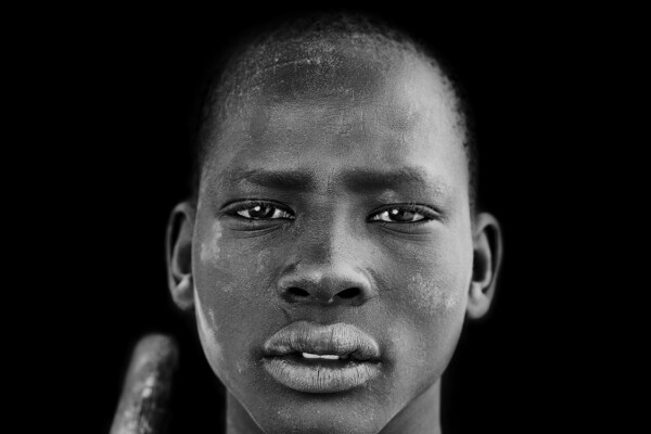 black and white portrait of a cattle herder in south soudan by Karolina Wojtasik