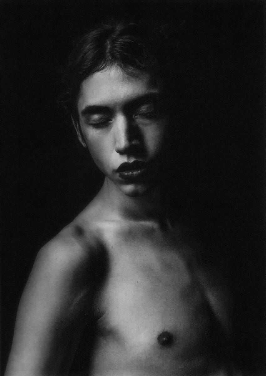 black and white studio portrait of a young man by Zoë Chiara