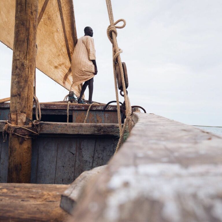 Travel photography by Jody Macdonald. Man stood on a boat