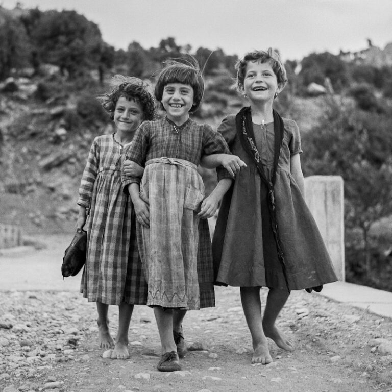 Black & white photography of Greece by Robert McCabe - Portrait of smiling children