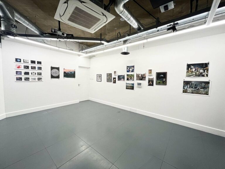 Photo of an exhibition space with photos on the wall