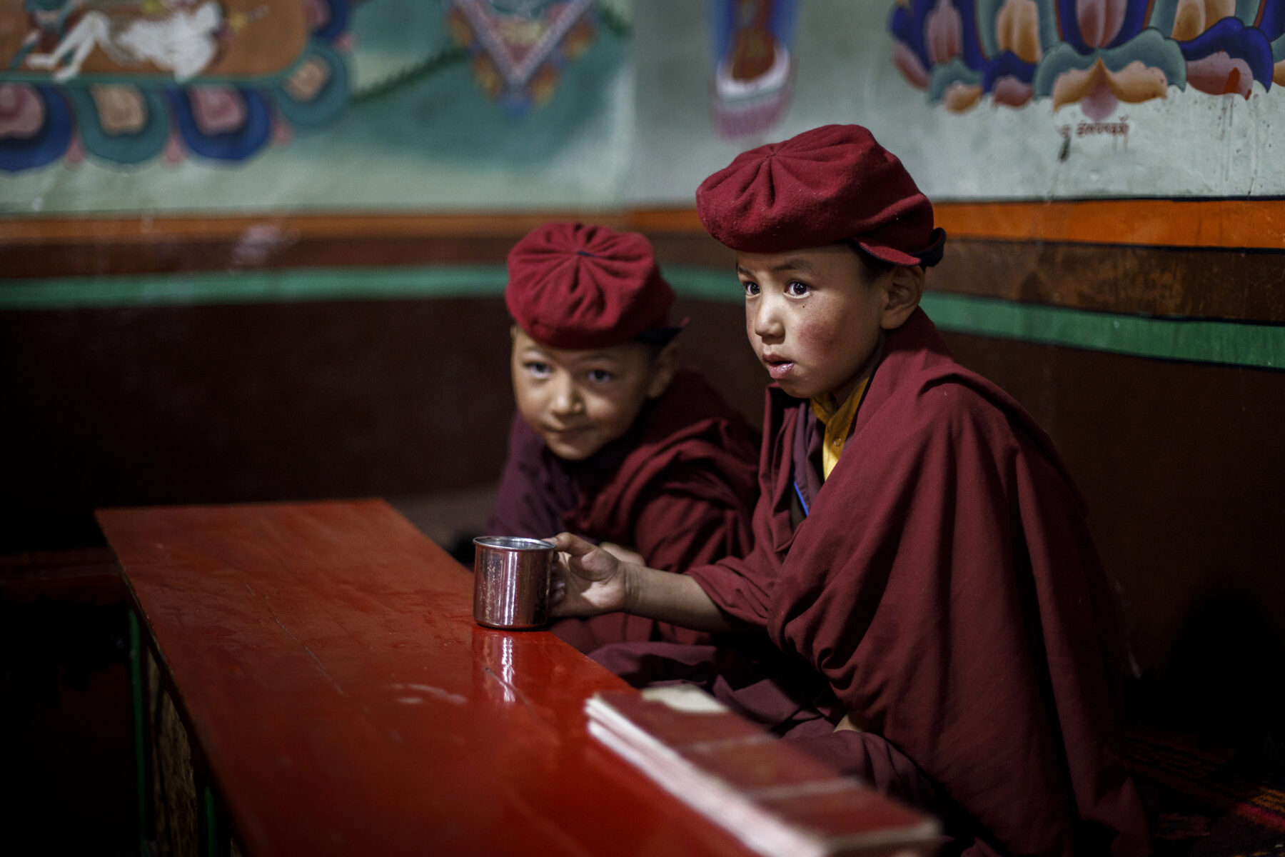 Color portrait photography of two young monks in Ladakh, India by Lorenzo Perotti