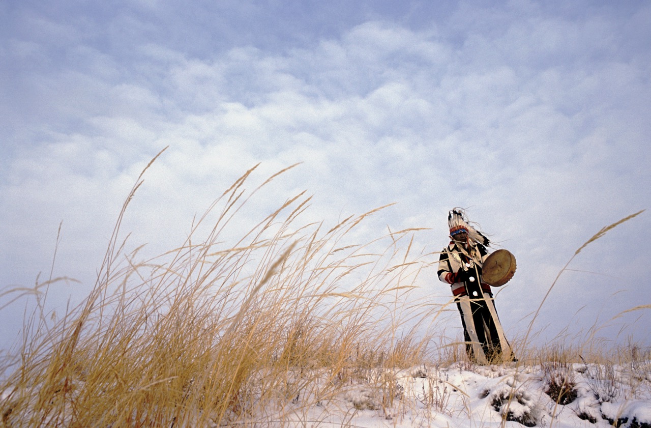 Photo of a native american chief praying by Maggie Steber