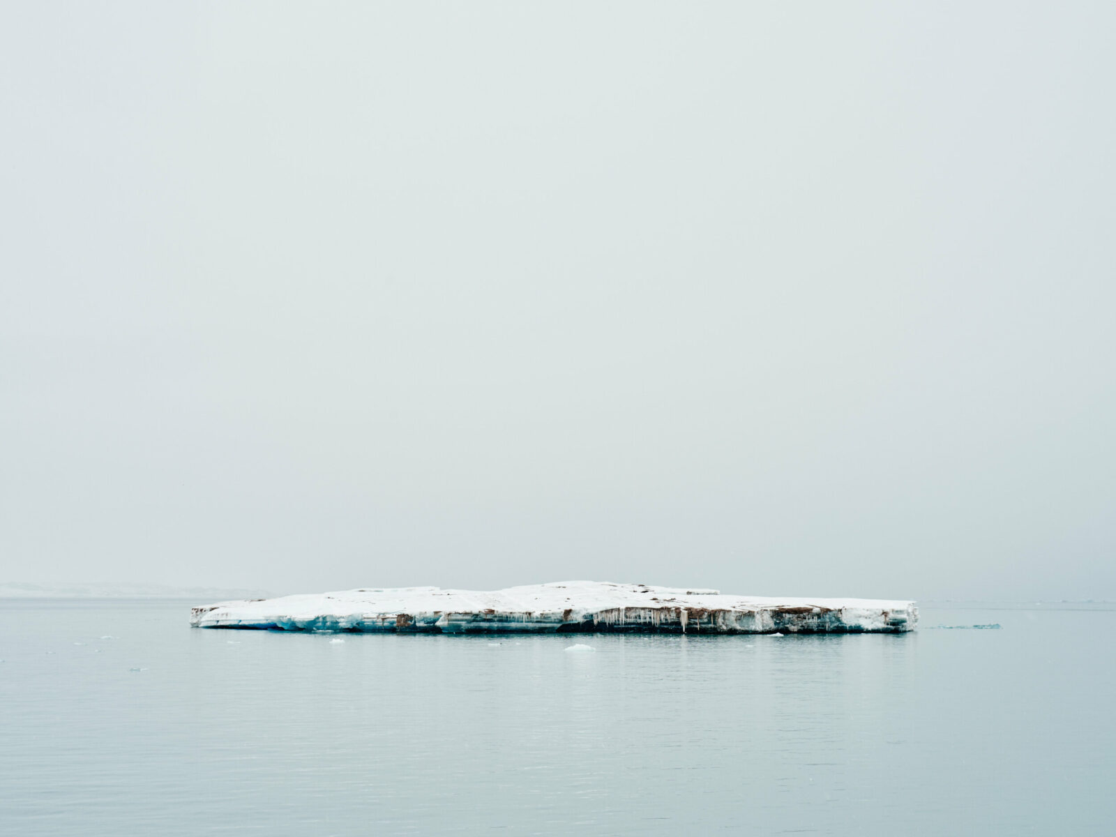 Landscape photo of a smalle iceberg in Norway by Brooke Holm.