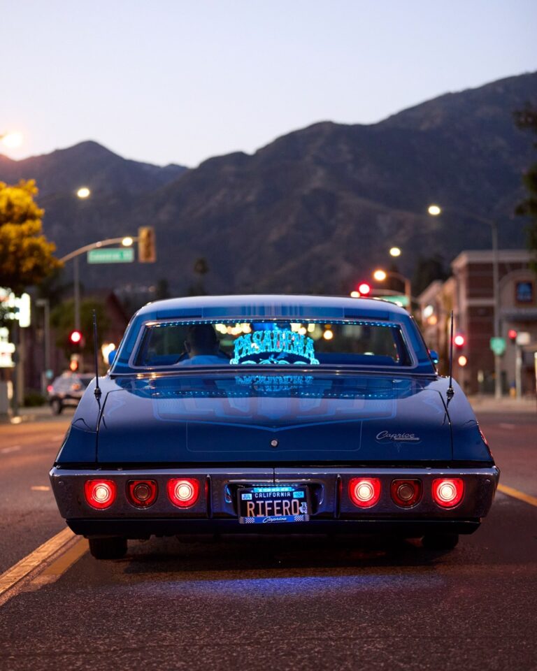 Documentary photography by Owen Harvey. Car driving down a road in LA in the evening. From the project Ground Clearance LA