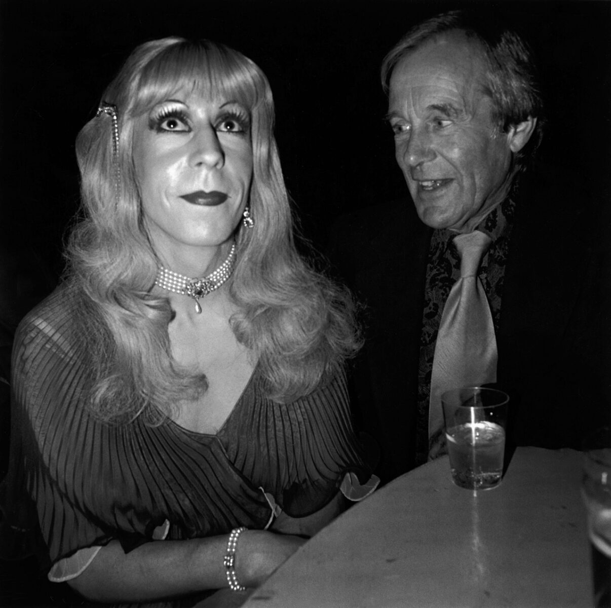 Photo of a woman in drag and a man in a bar by Chris Steele Perkins