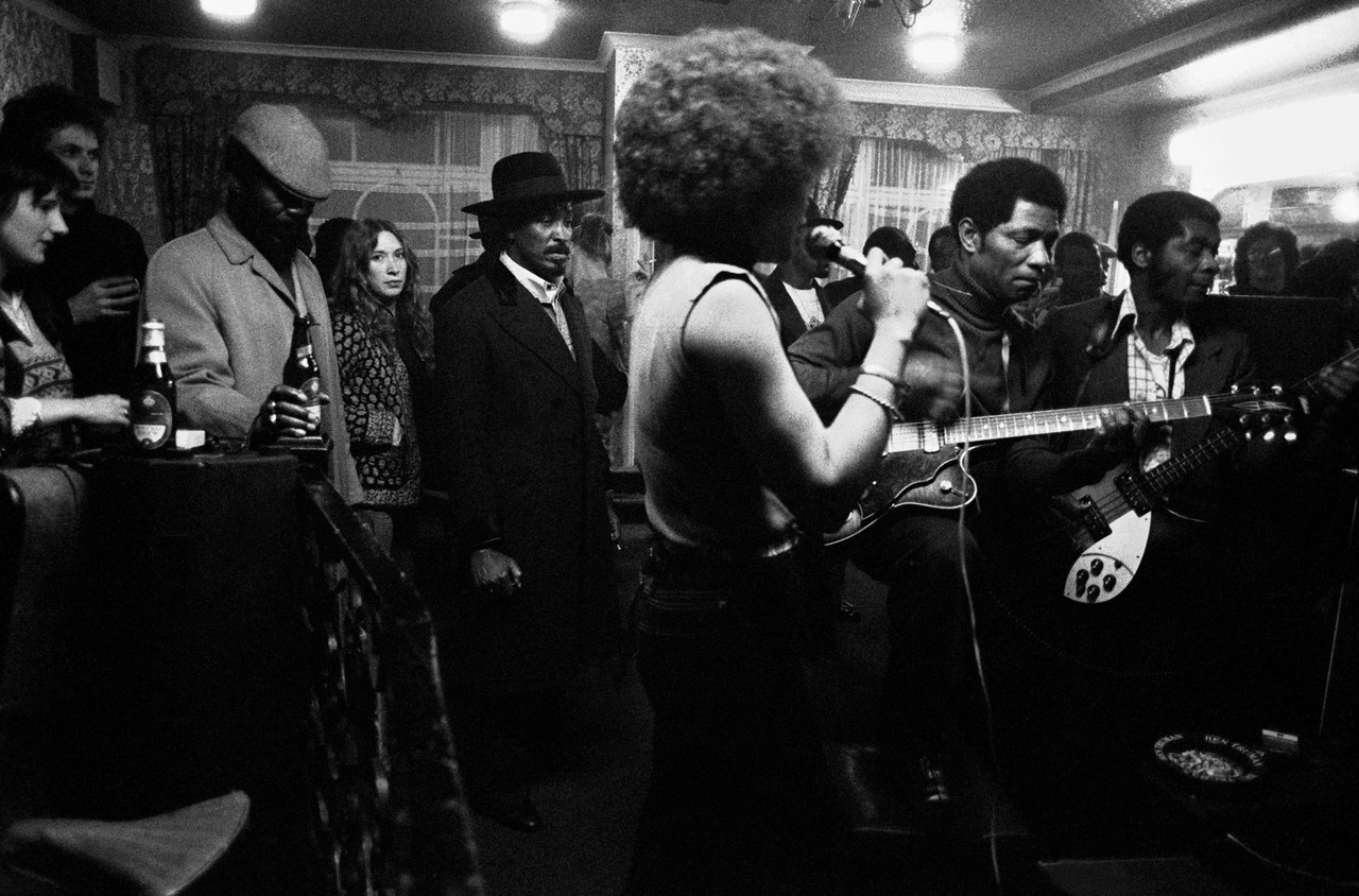 Black & White photo of a party in a pub in Brixton, London, 1978 by Chris Steele Perkins