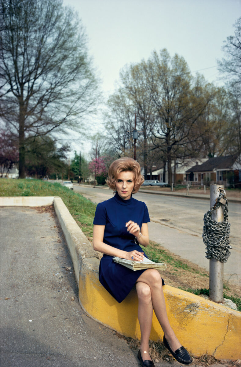 Color photography by William Eggleston. Portrait of a woman in blue.