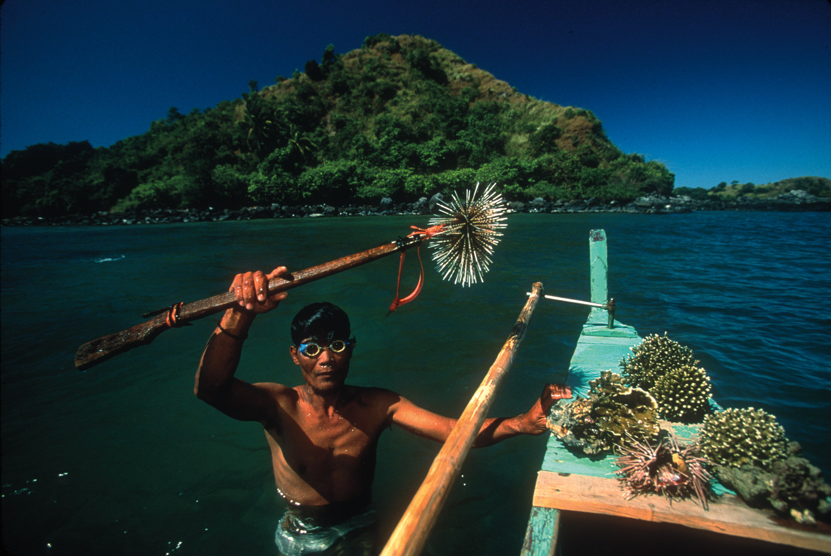 Photography by Michael Yamashita. Spear fisherman in the Philippines