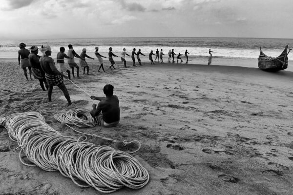 black and white photo of fishermen in India by Salvatore Franco