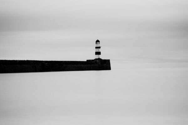 black and white landscape photo of English coast by Victoria Clarke