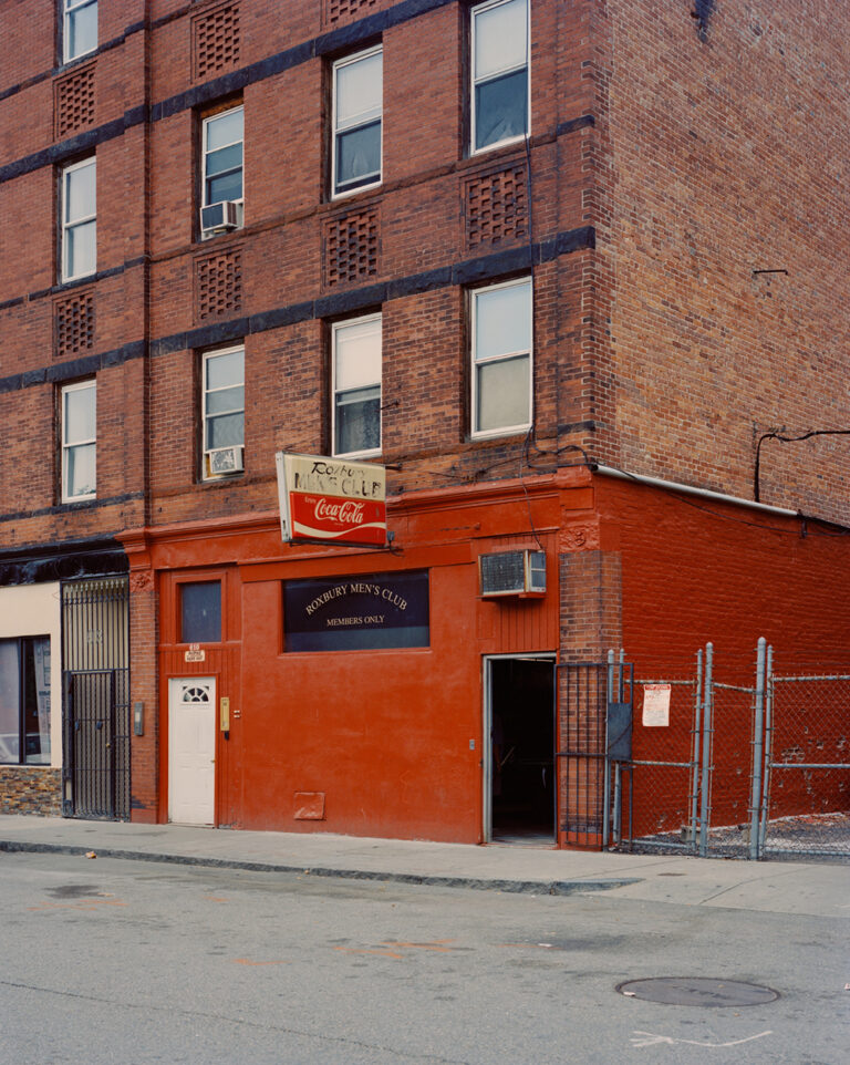 Color portrait photography by Mikel Bastida. Red building.