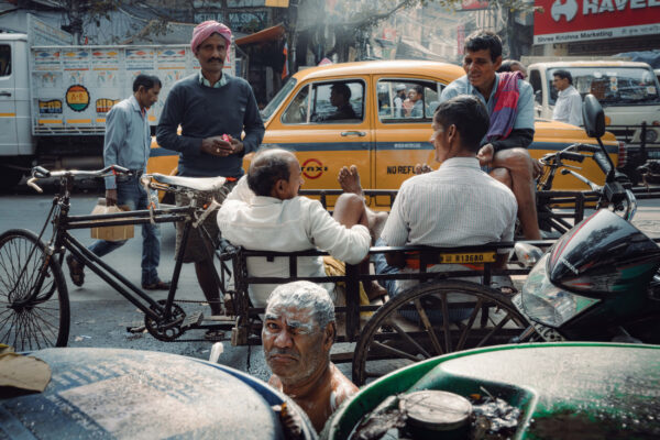 street color photo of people in Kolkata, India by Billy Dinh