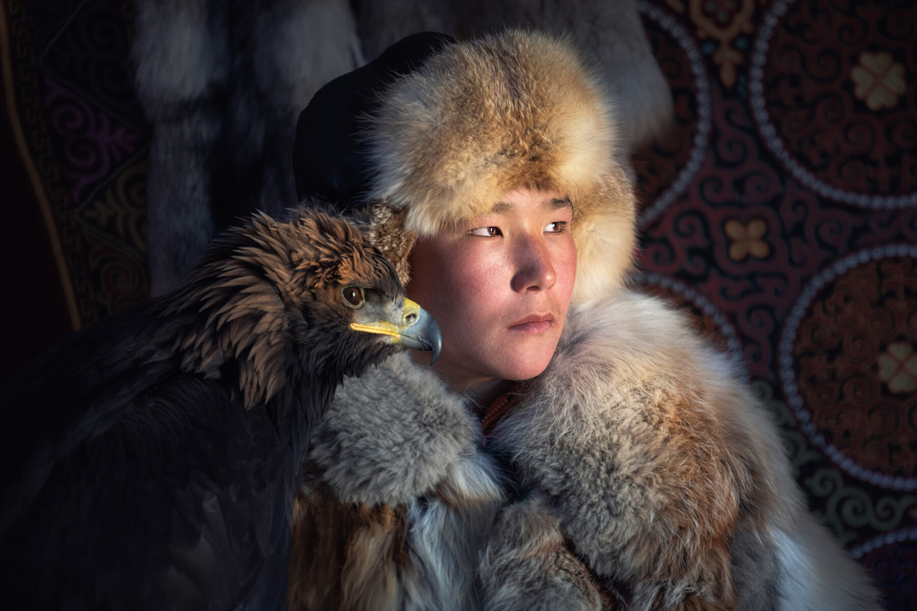 color portrait photo of eagle hunter in Western Mongolia by Diana Barthauer