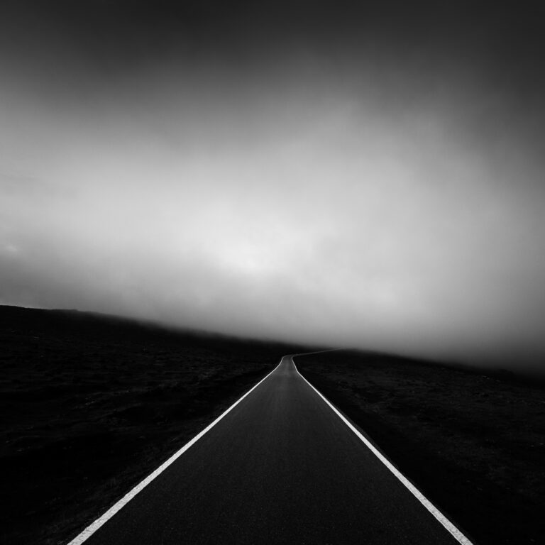 black and white landscape film photo of a road by Alexandre Caetano