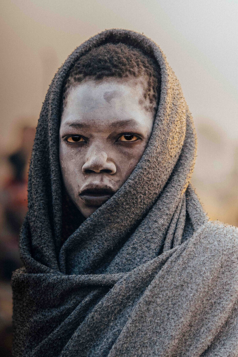 color portrait photo of a young Mundari boy in south sudan by Frances Bruchez