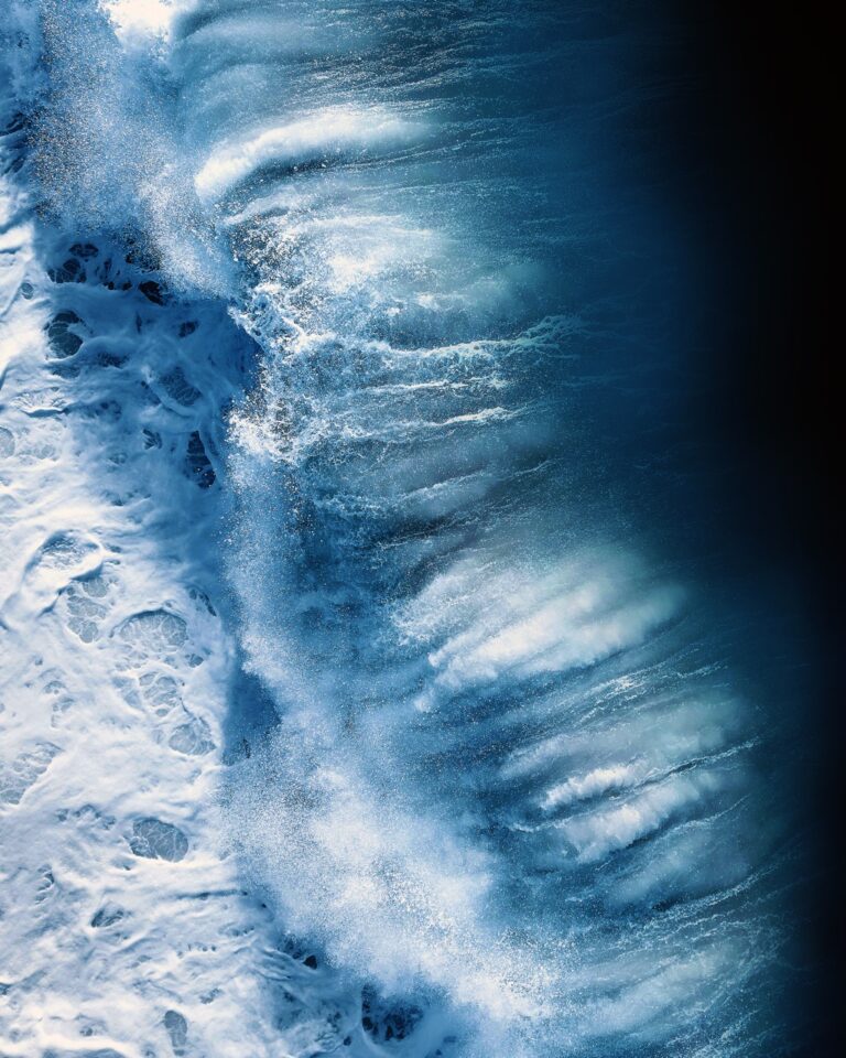 Aerial photo of ocean waves by Joanna Steidle